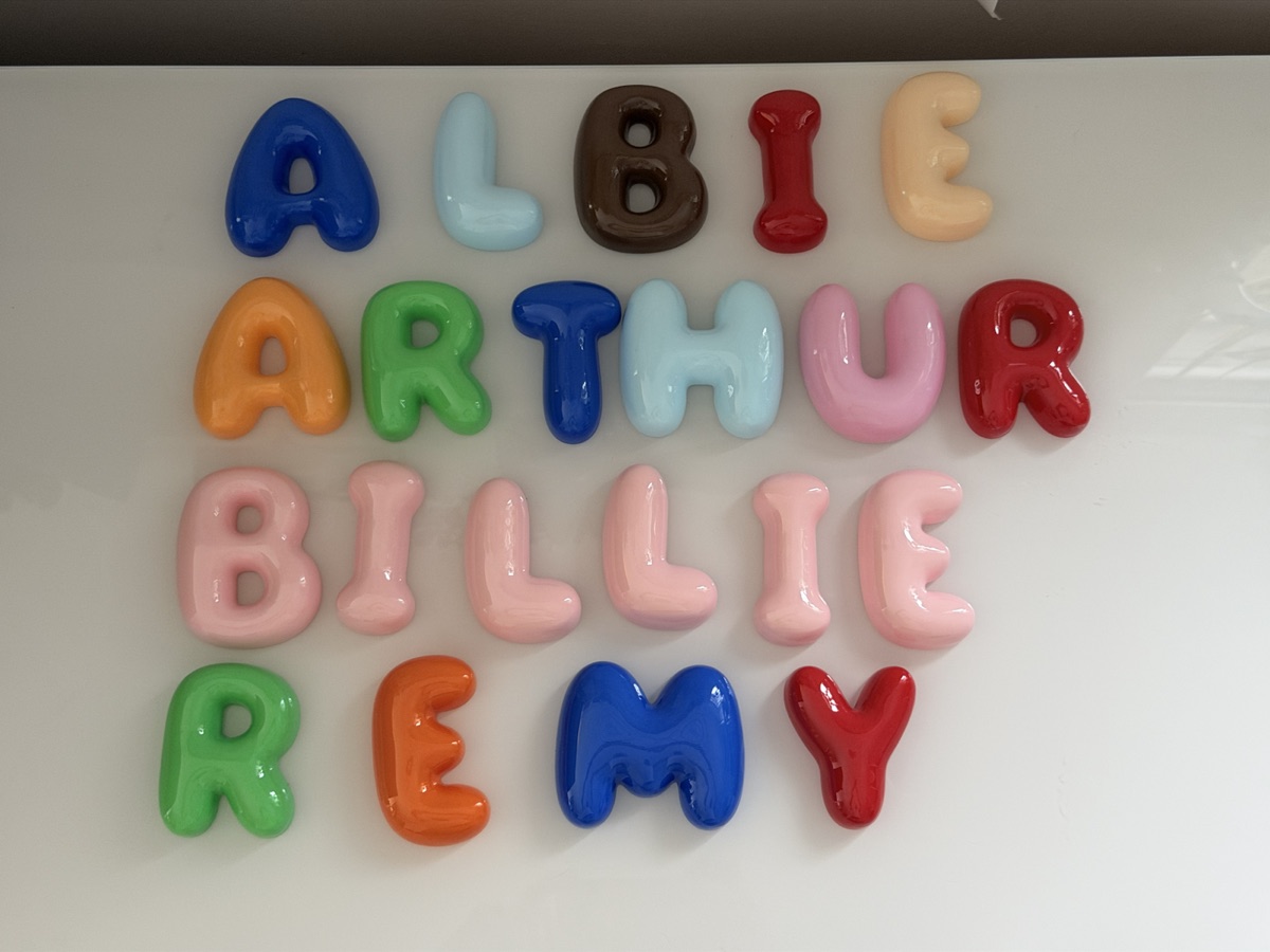 A collection of finished colourful personalised bubble letter names